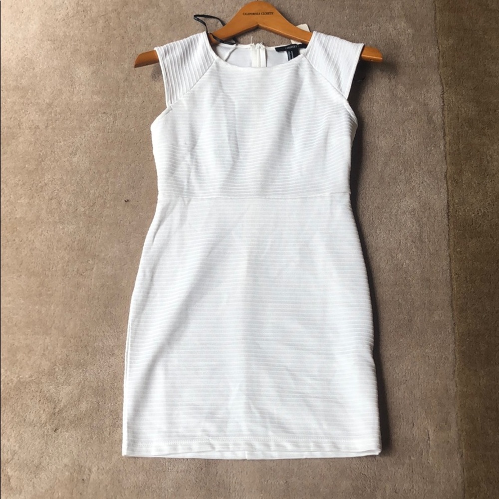 Bodycon white sparkle dress.